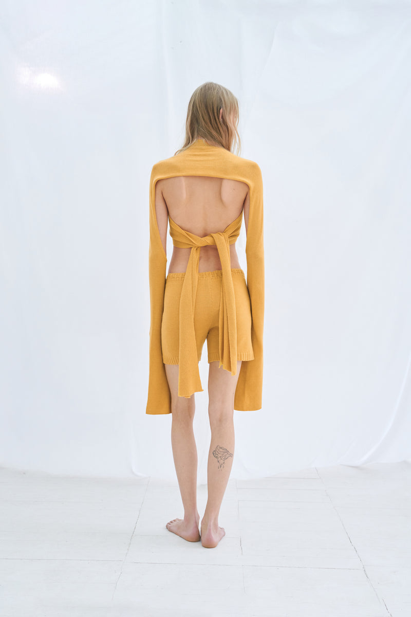 Crossover orange strap top